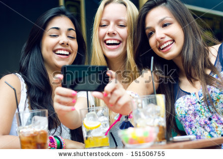 stock-photo-outdoor-portrait-of-three-friends-taking-photos-with-a-smartphone-151506755
